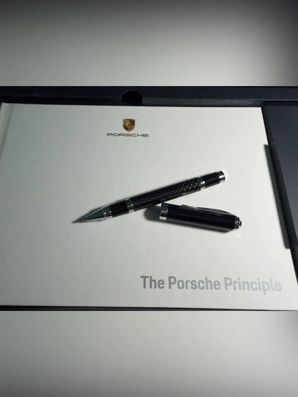 Porsche New Pen with book in box Case with Silver Logo.